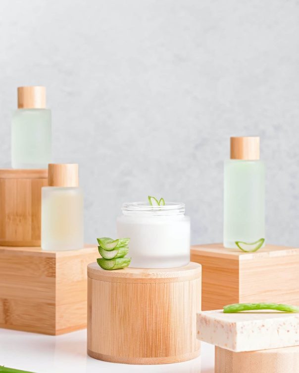 Natural cosmetics with aloe vera on podiums